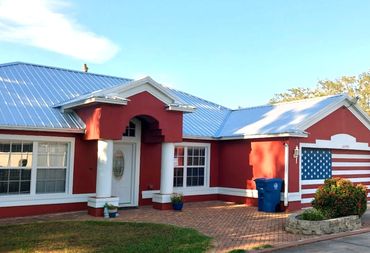 ultra-rib metal roof on a red house