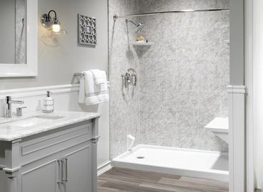 HomeCraft Bath shower in artic ice wall surrounds, chrome finishes, white bench and white drain