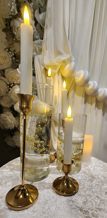 Elegant candles and floral decor create a warm, romantic ambiance.