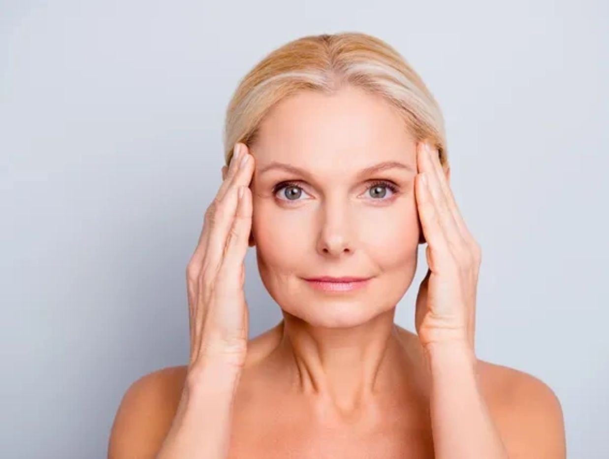 Lady showing her face after anti-wrinkle treatment