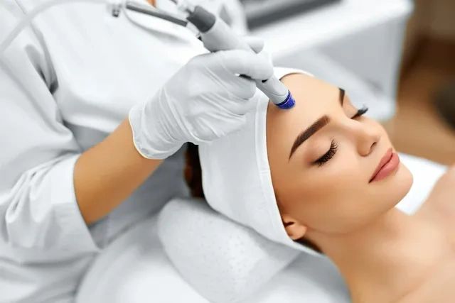 Woman having a skin booster treatment at a beauty saloon