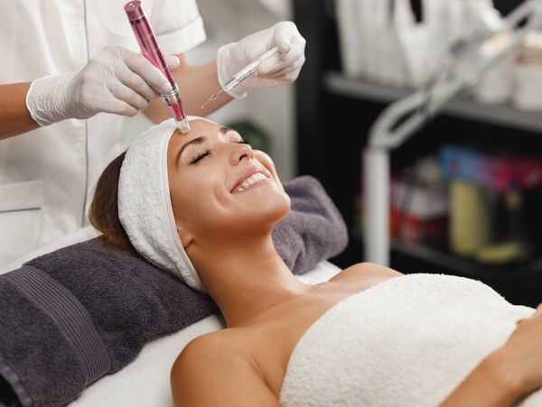 Woman having a skin booster treatment in beauty saloon