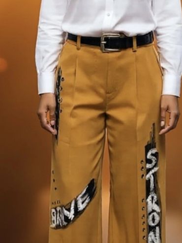 tan pants with painted affirmations