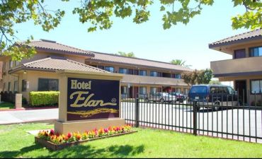 Exterior repaint of the Hotel Elan, a commercial property in San Jose, showing the freshly painted t