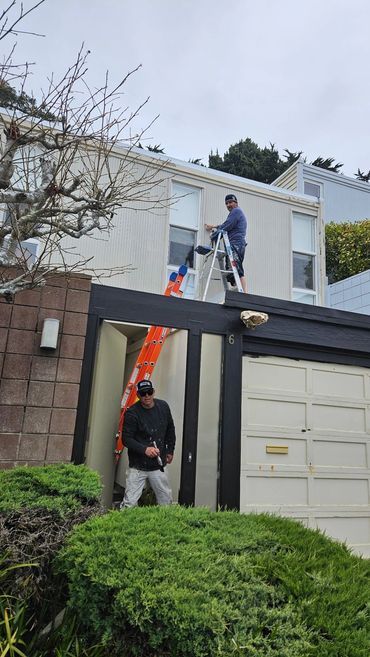 A&R Bentley crew member painting a two-story home exterior in San Jose