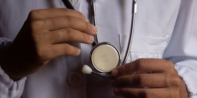 Doctor holding a stethoscope.
