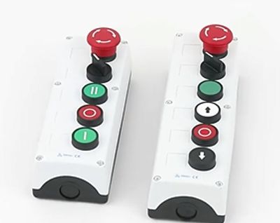 2 pushbutton enclosure side by side, one has a set of 5 buttons while the other has 6 in total.