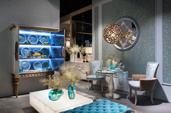 Stylish dining room with floral decor and illuminated cabinet.