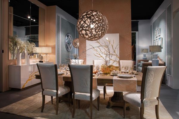 Elegant dining room with intricate lighting and decorative centerpiece.