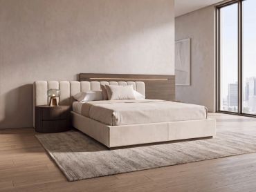 Modern minimalist bedroom with beige bed and wooden side table.