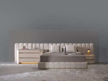 Modern minimalist bedroom with neutral tones.