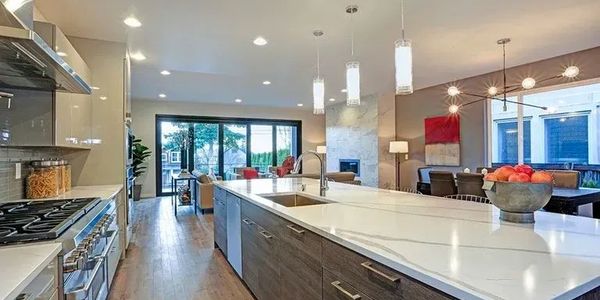 Modern kitchen with large island and open living space.