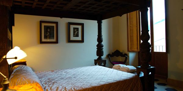 Elegant antique four poster bed in a three bedroom holiday apartment in Sulmona, Italy