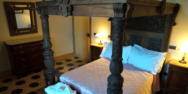 Beautiful hand carved bed in a three bedroom vacation rental in Sulmona, Abruzzo, Italy