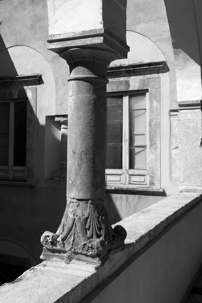 Ancient pillars looking out into the courtyard of a 16th century palazzo. Historic centre of Sulmona
