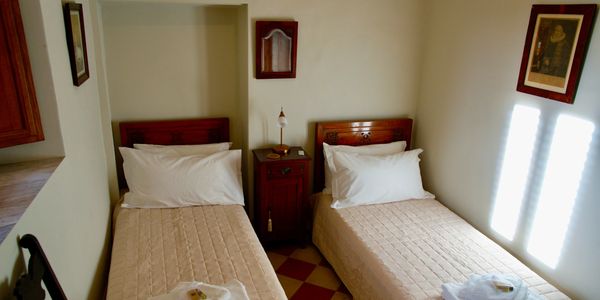 Elegant twin bedroom in a three bedroom vacation rental apartment in Sulmona, Italy