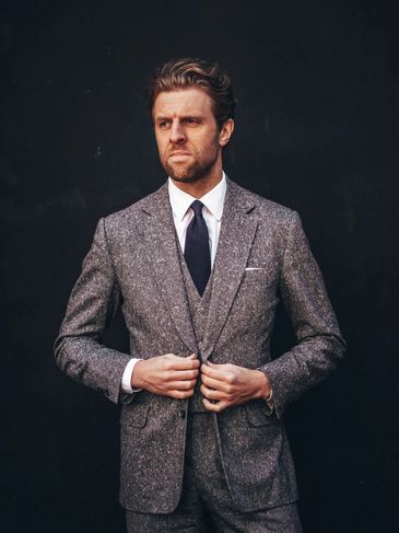Nicholas in a grey Donegal tweed three piece suit