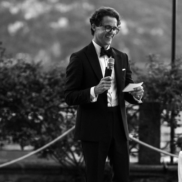 A best man delivering a speech at a wedding in Italy