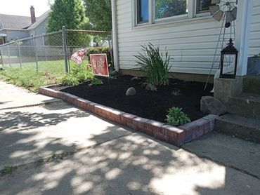 iu east, rocks, chain link fence, mulch install, brick install