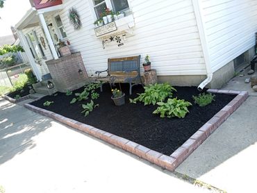 brick, install, mulch, bench, tree stump, red, white, flowers, pots, lights,