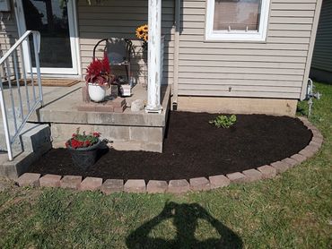 Brick, stone install, flowers, mulch, flowers