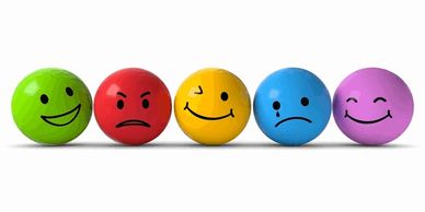 Colorful balls showing different facial expressions representing various emotions.