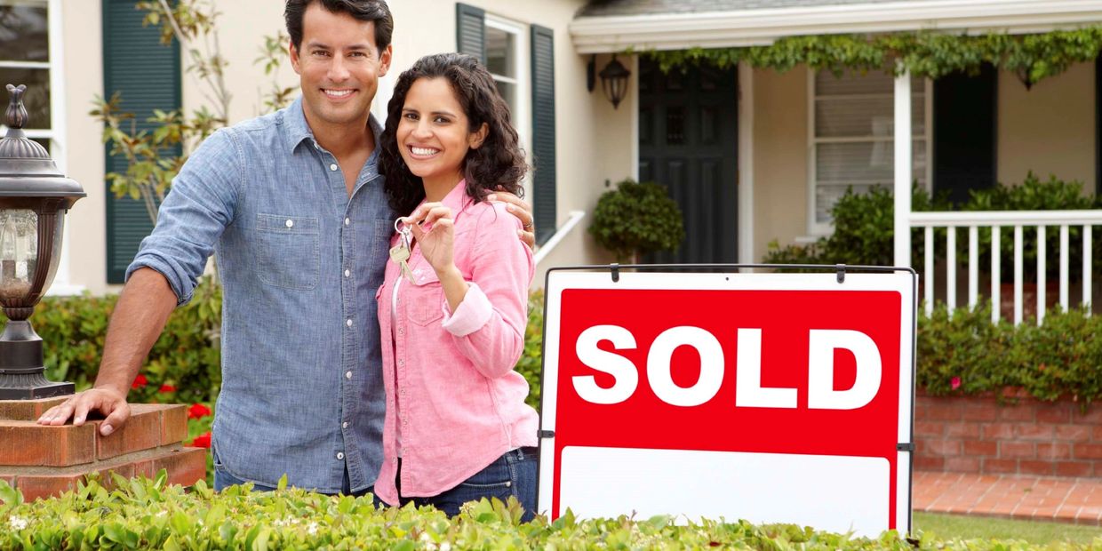 Picture of happy couple Home Sellers Home Buyers Investments and Appraisal Services.