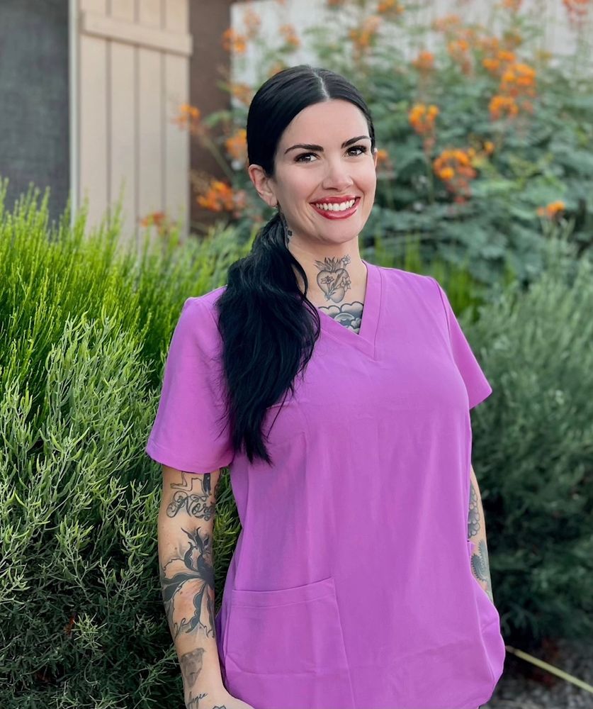 Summer in scrubs smiling