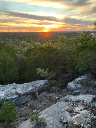 CLIFF VIEW OVERLOOKING THE MOUNTAIN HOUSE RANCH AT DUSK