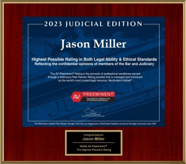 Award plaque recognizing Jason Miller for highest legal and ethical standards in 2023.