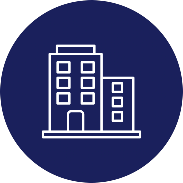A white building icon on a dark blue circular background.