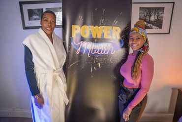 The host and guest with the POWER Mouth logo background