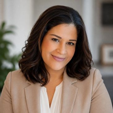 Professional woman smiling confidently in business attire.