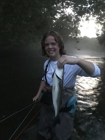 Riley Macdonald with his first striper on a spey rod to boot!