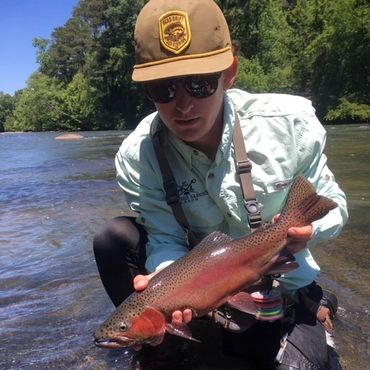 My nephew Sam with a colored up rainbow with a kipe