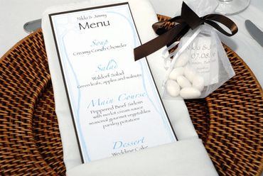 place setting with menu and 'coufetta' favor
