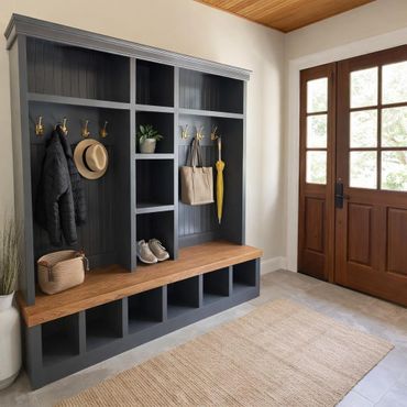 Organized mudroom with dark shelves, wooden bench, and natural light from glass-paneled door.