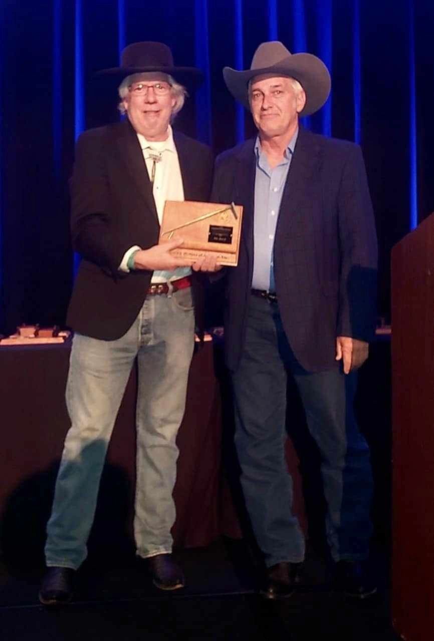 Johnny D. Boggs Presenting the WWA 2024 Branding Iron Award to R.G. Yoho.