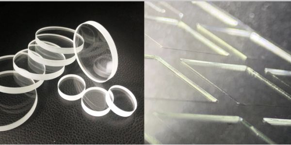 Various transparent optical lenses and a close-up of etched glass lines.