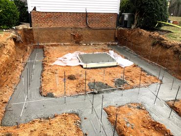 Basement footing with elevator pad.