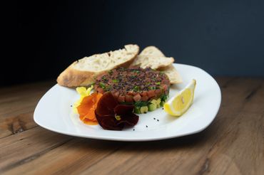 Our tuna tartar with avocados and garnish, offered in Orlando Hookah Lounge.