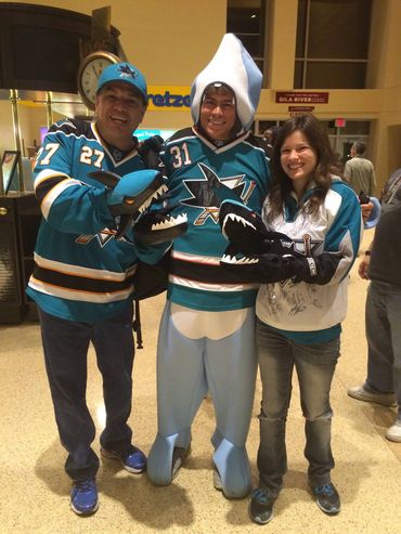 Three people posing for a photo with sharks Gloves