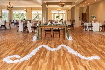 The ballroom at the Manor at Mountain View decorated in an ivory and blush color scheme 