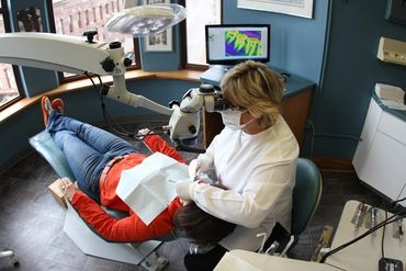 Dr. Susan Micklow performing an Endodontic exam