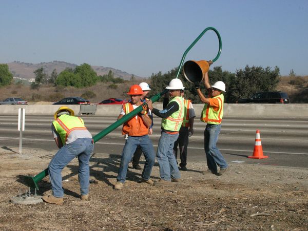Some people installing street land at the side of street