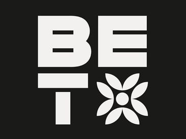 Bold white letters spelling 'BET' with a flower symbol on a black background.
