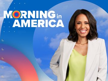 Smiling woman in white blazer on a bright Morning in America backdrop.