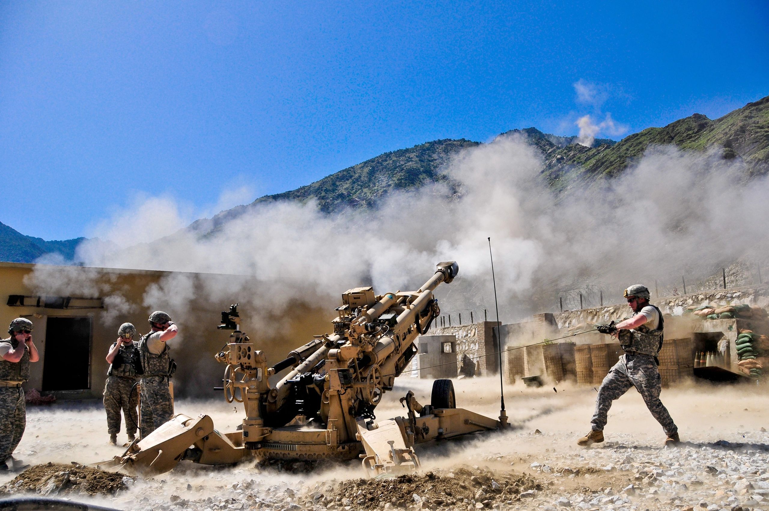 101st Airborne Division soldiers fire artillery rounds at enemy fighting positions in Afghanistan.