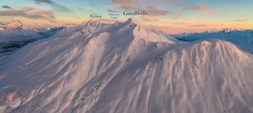 Snow-covered mountain peaks with labeled names at sunrise or sunset.