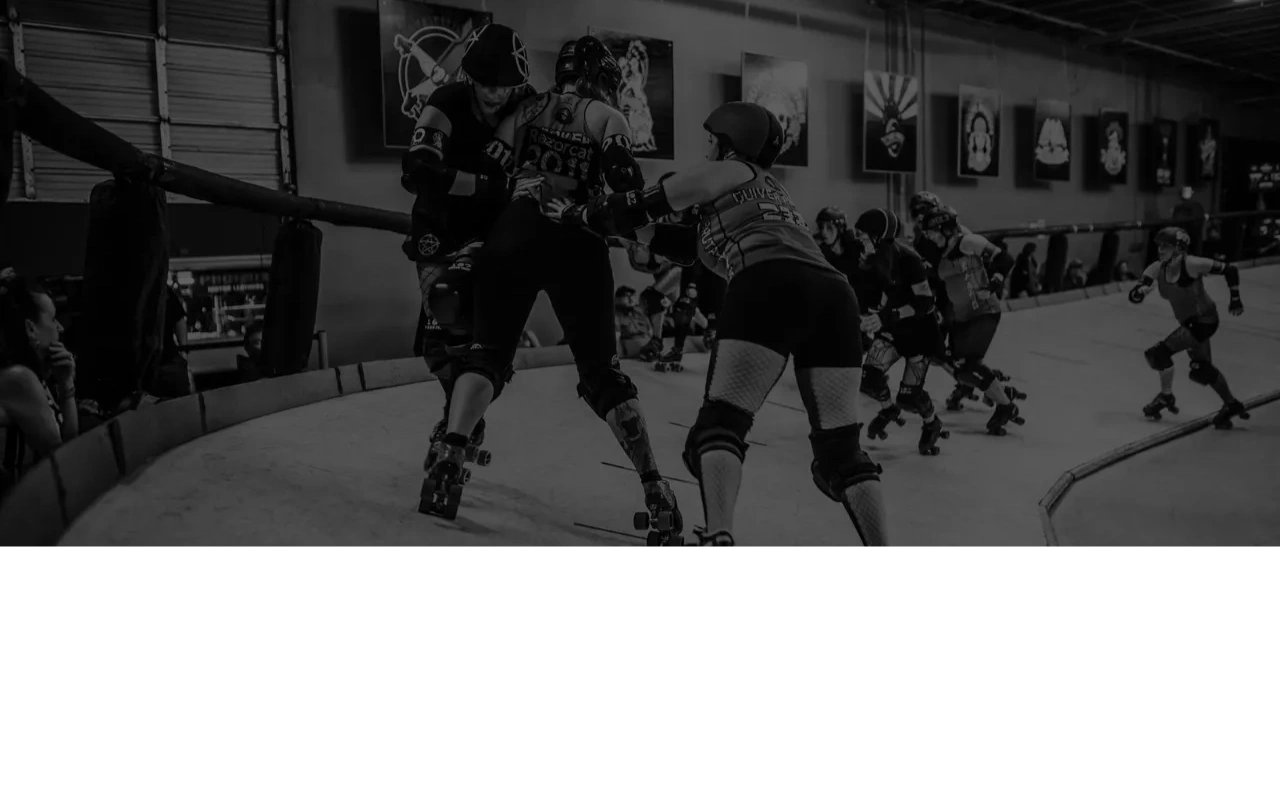 Roller derby athletes playing during game